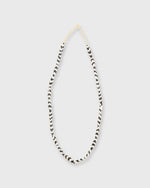 Load image into Gallery viewer, Small Elongated Cowbone Beads Brown/White Zigzag