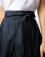 Load image into Gallery viewer, Pleated Wrap Skirt in Navy Silk Shantung
