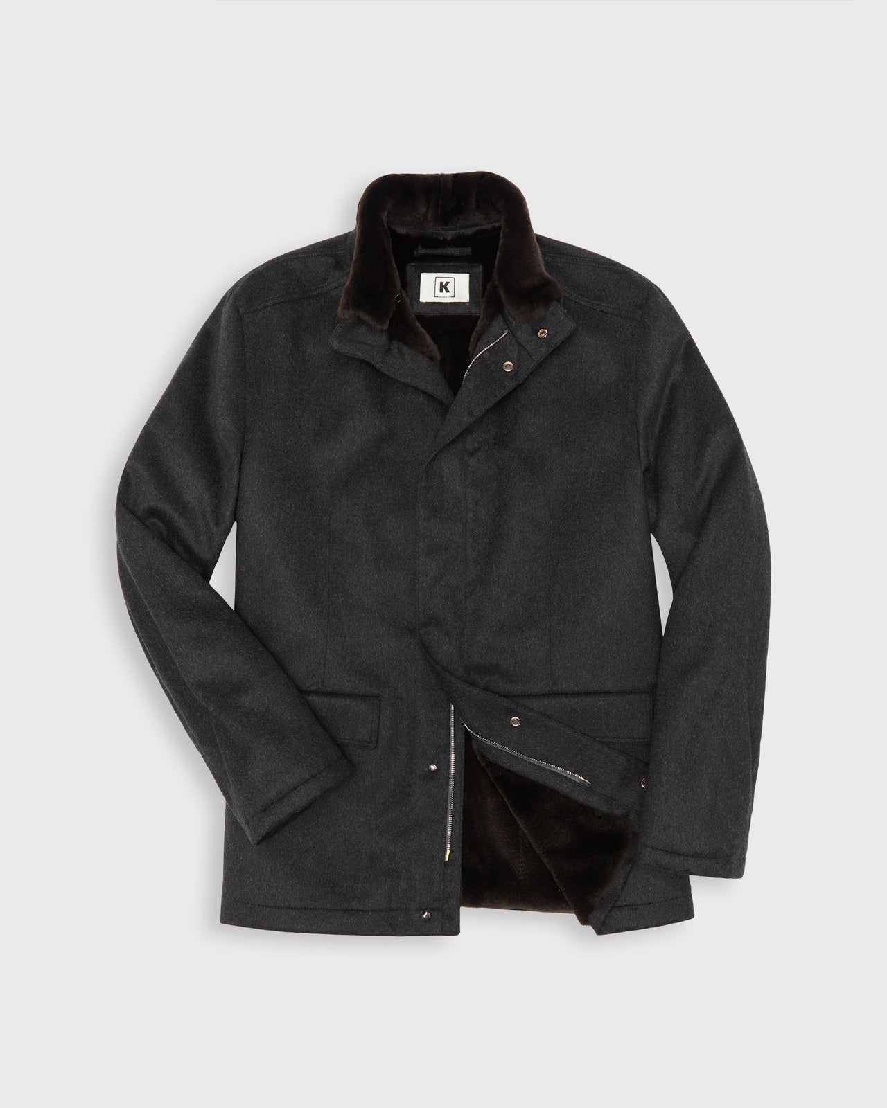 A dark charcoal gray cashmere jacket with a brown beaver fur lining and removable collar, shown on a light gray background.