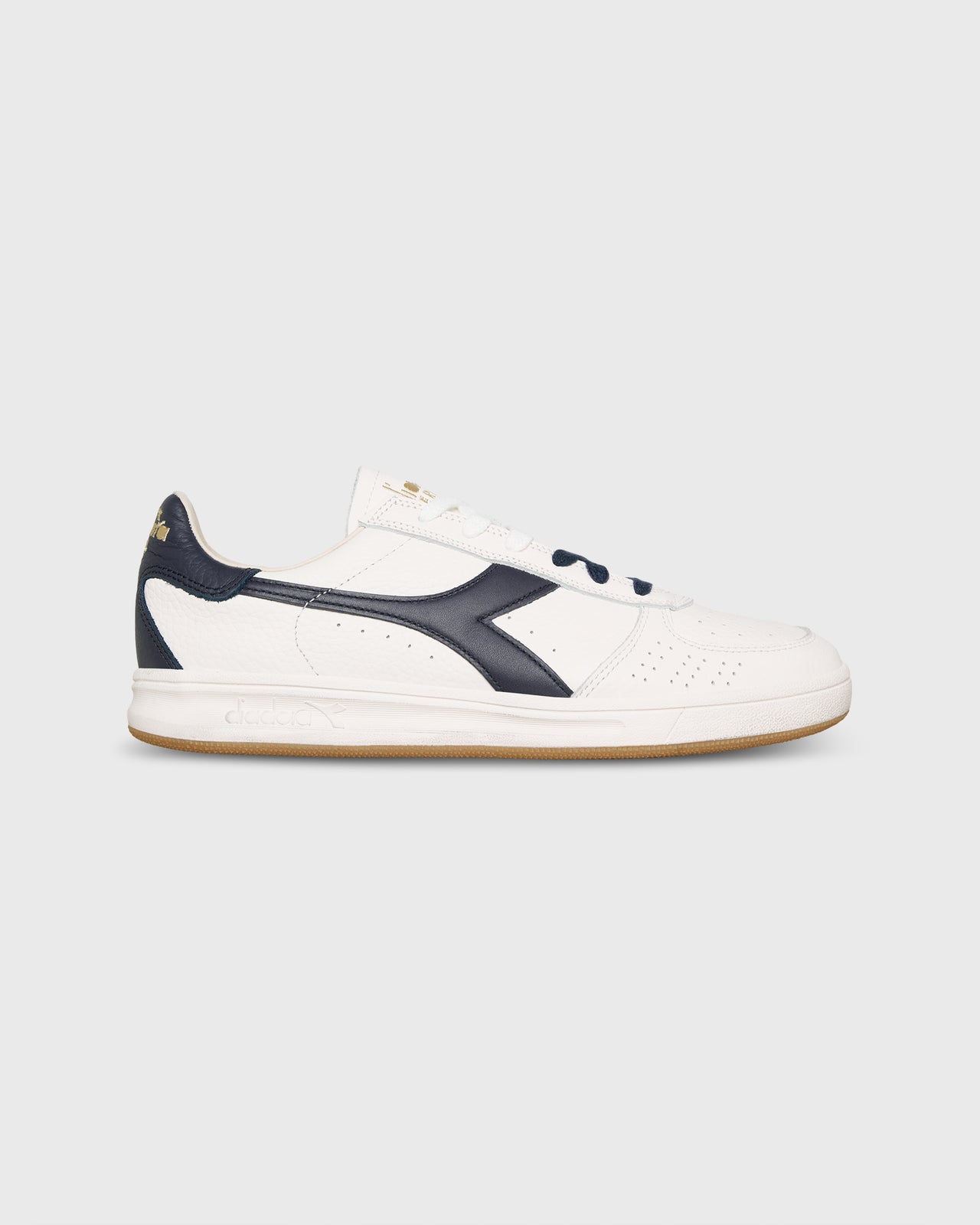 B. Elite Domino Sneaker in White/Peacoat