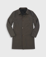 Load image into Gallery viewer, A reversible dark brown wool and nylon water resistant utility coat with a pointed collar, button front, and side pockets, displayed flat against a light gray background.
