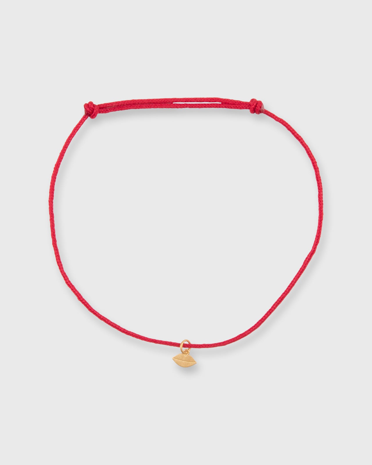 Small Kiss Charm Bracelet in Gold/Assorted Color Cord