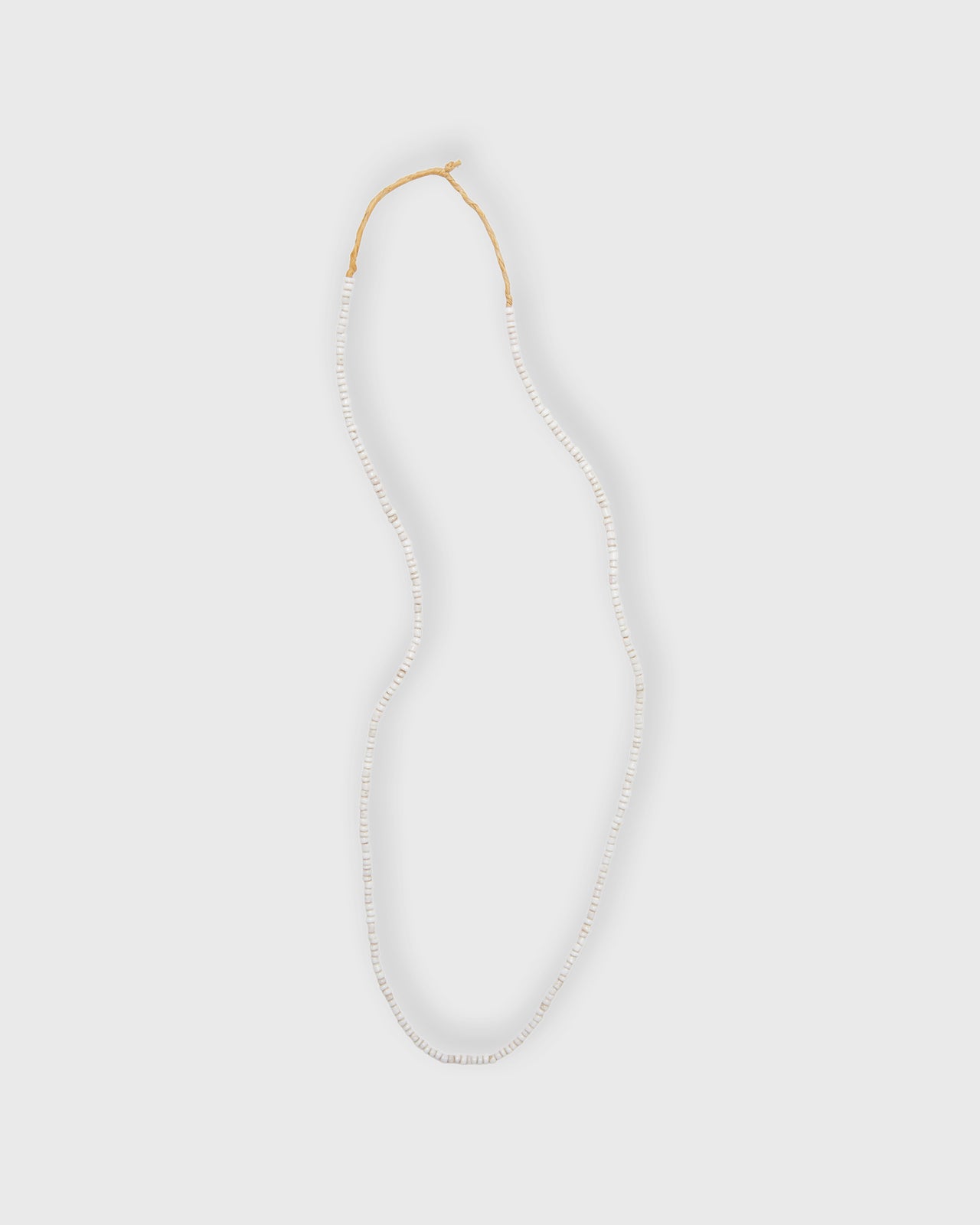 Tiny African Beads in Desert Sand