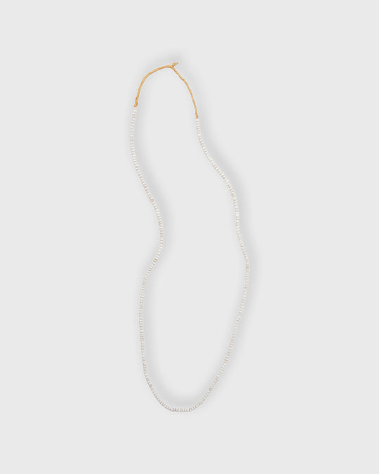 Tiny African Beads in Desert Sand