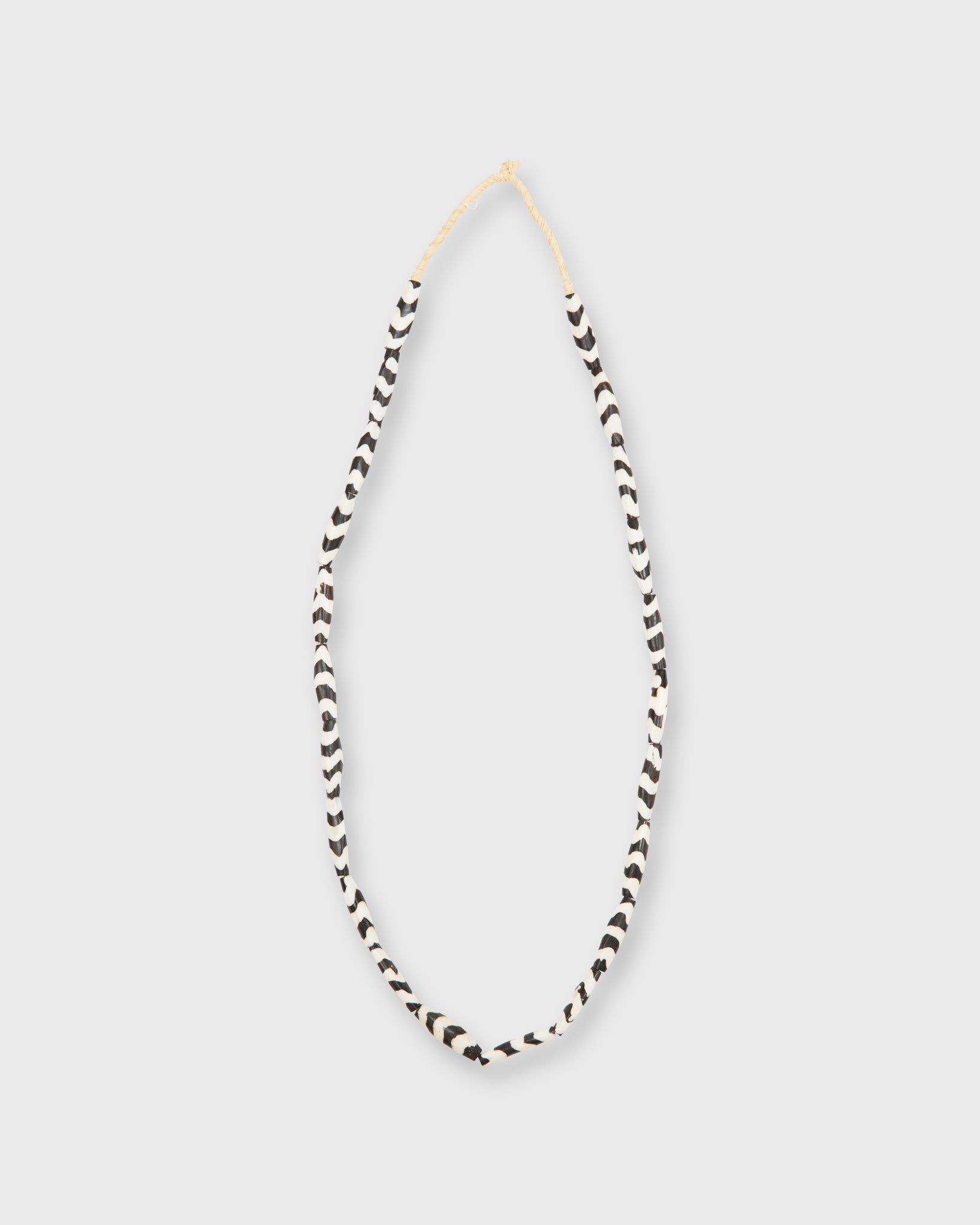 Small Elongated Cowbone Beads Brown/White Zigzag