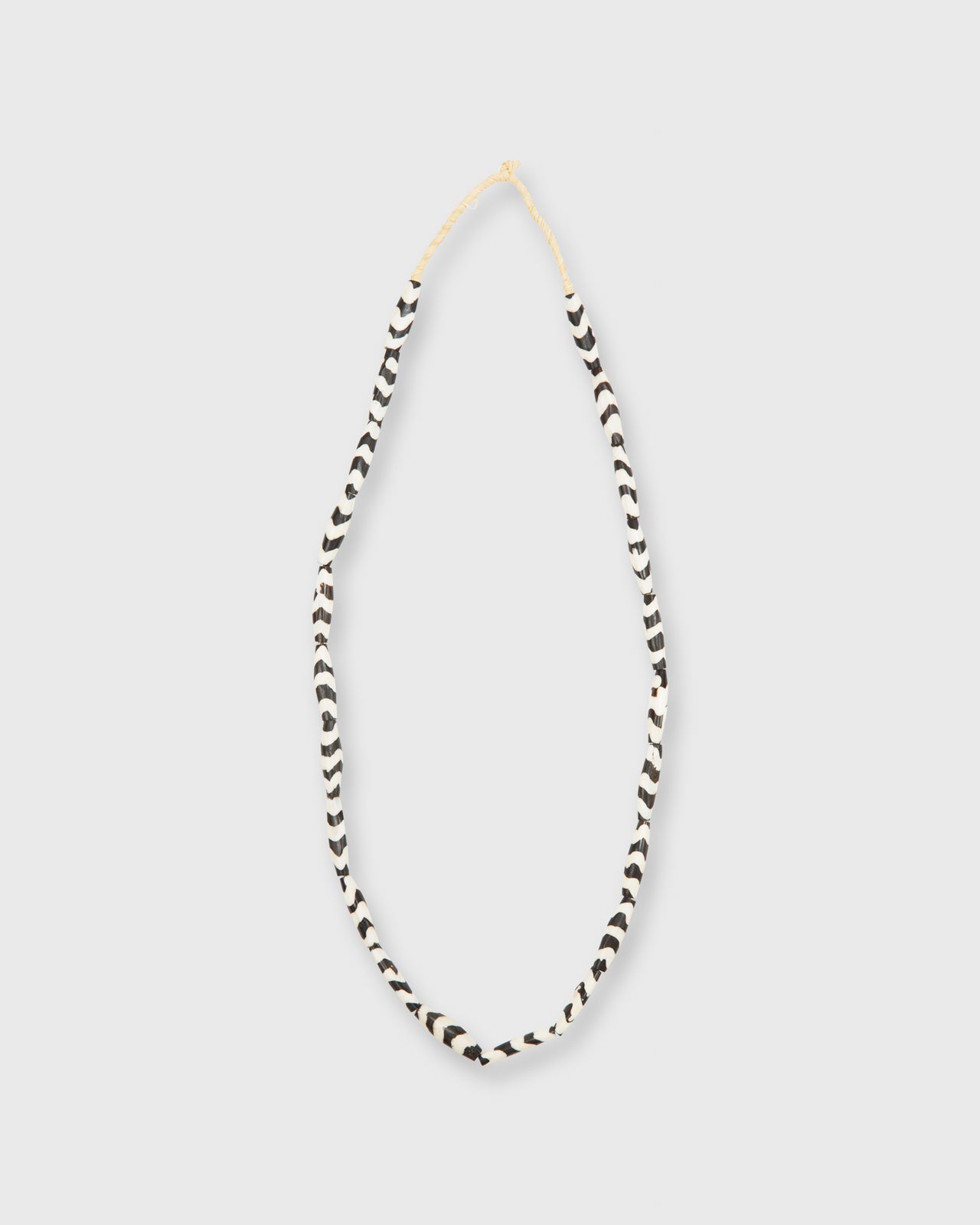 Small Elongated Cowbone Beads Brown/White Zigzag