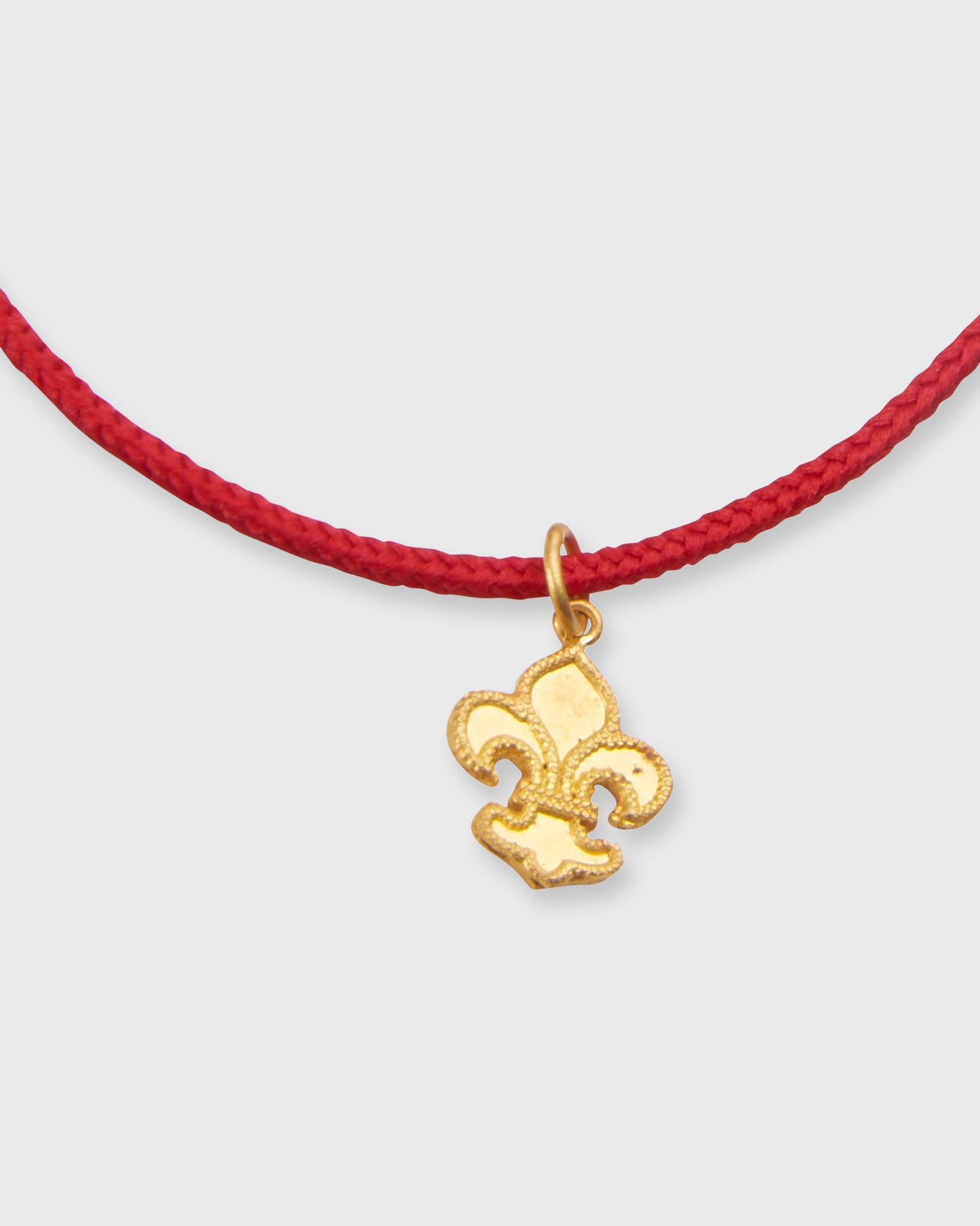 Fleur De Lys Charm Bracelet in Gold/Red Cord